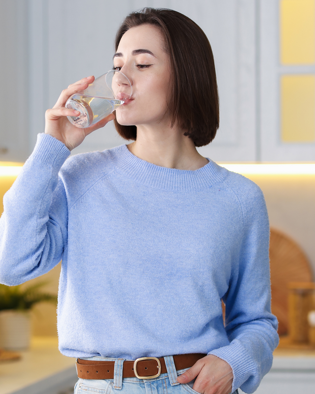 drinking a glass of water from a soft water systems